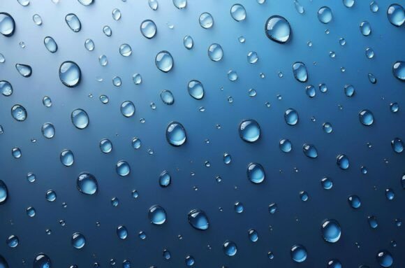A Group of Water Drops on a Blue Surface