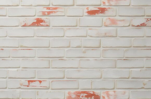 A White Brick Wall with Red Paint Texture